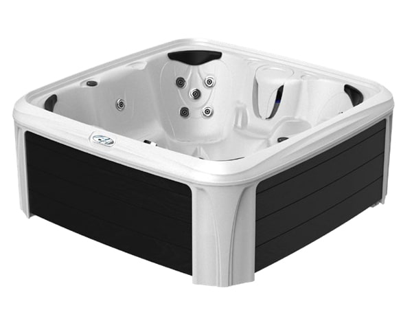 White acrylic hot tub with black exterior panels and multiple water jets, shown from an angled corner view for product display